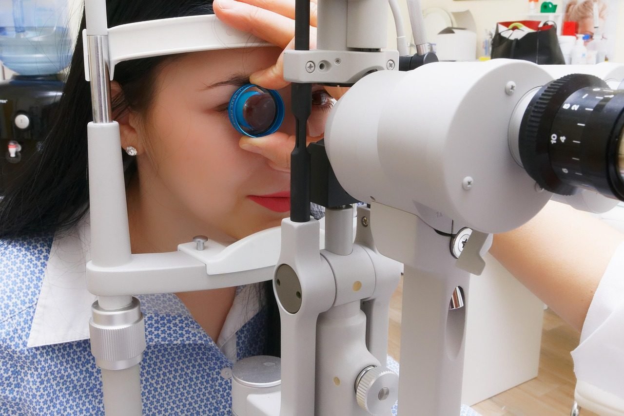 An eye examination being carried out on a slit lamp in a clinic.